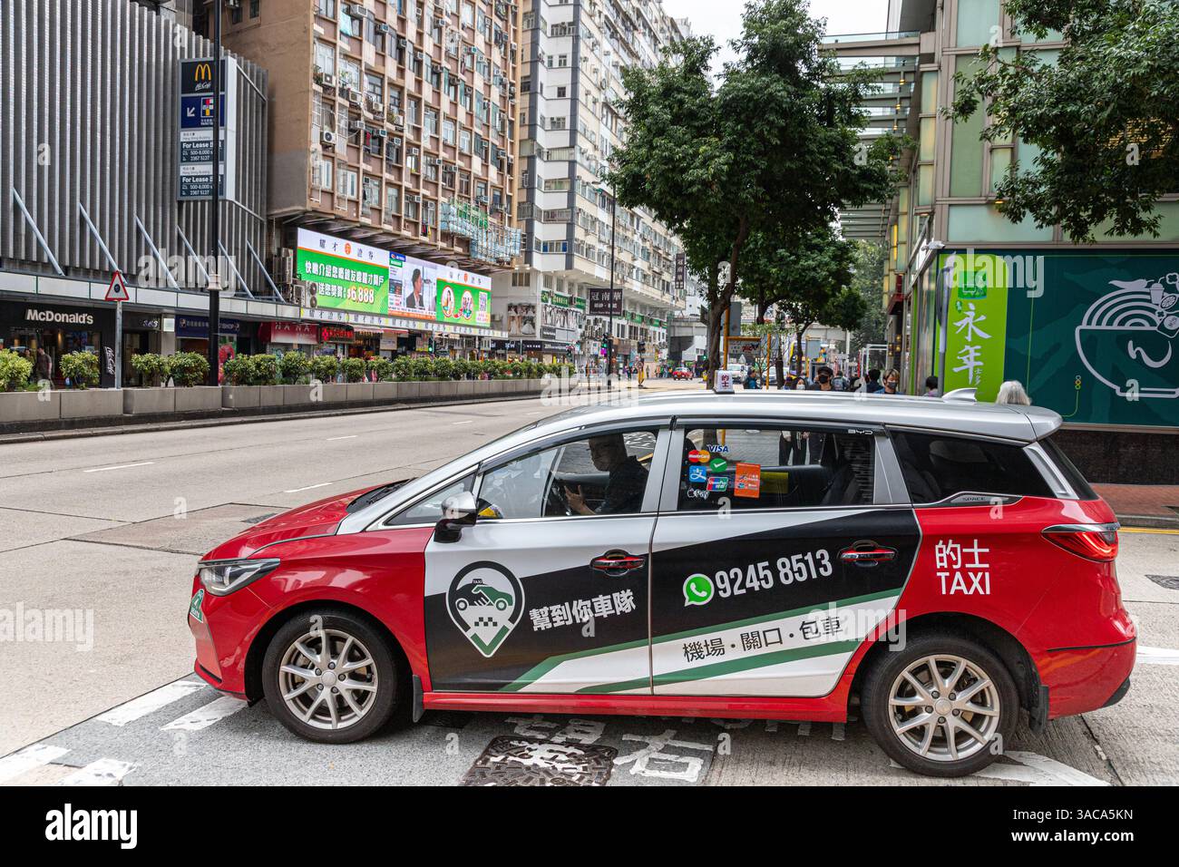 A typical taxi on Nathan Road, Kowloon, Hong Kong, China Stock Photo