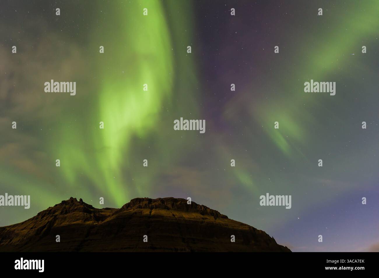 Northern lights above Kirkjufell Mountain in iceland Stock Photo