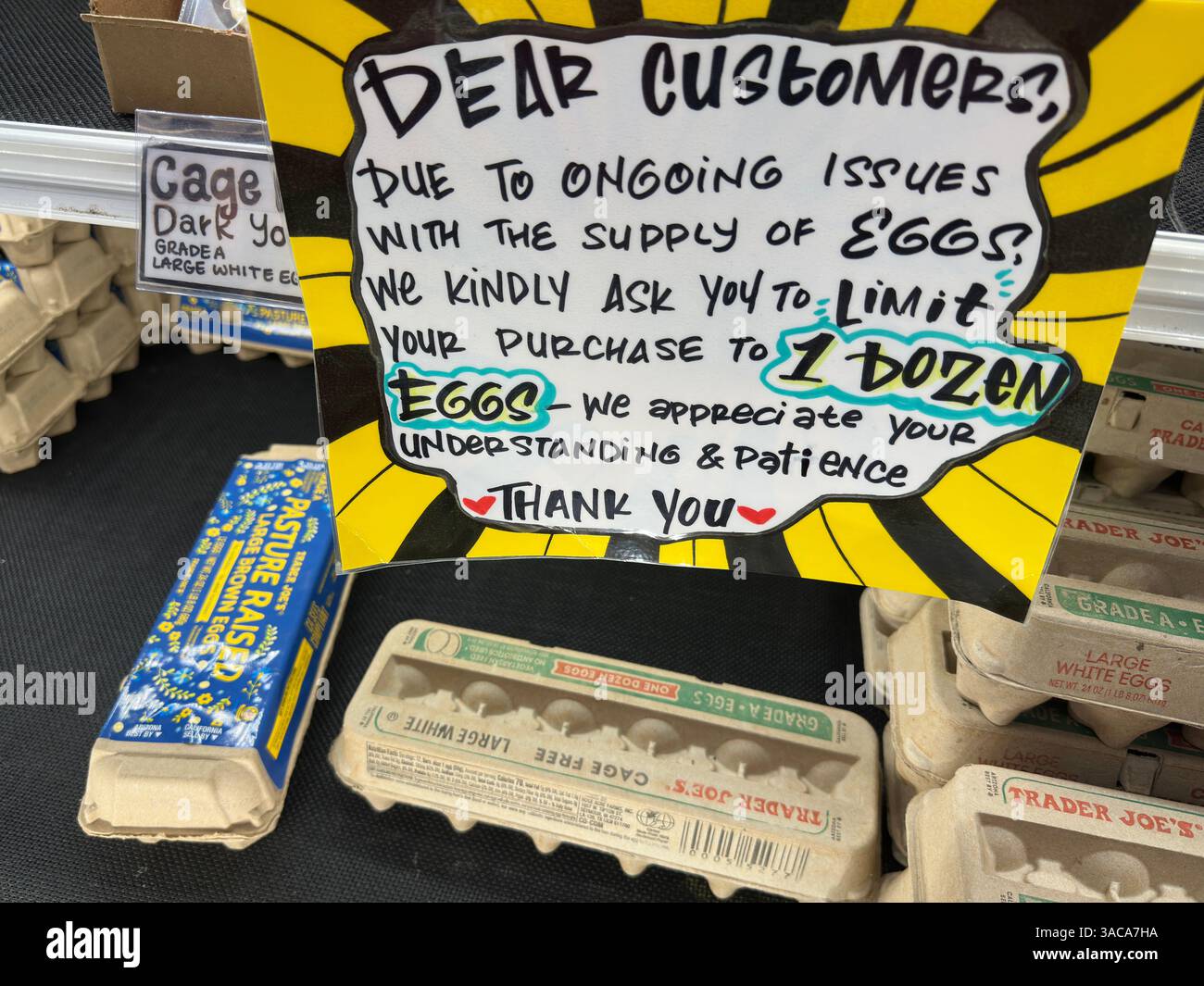 Toluca Lake, California, USA - March 28, 2025: A sign in a Trader Joe’s grocery store requests shoppers to limit egg purchases to one dozen. - Smartphone Captured Stock Image
