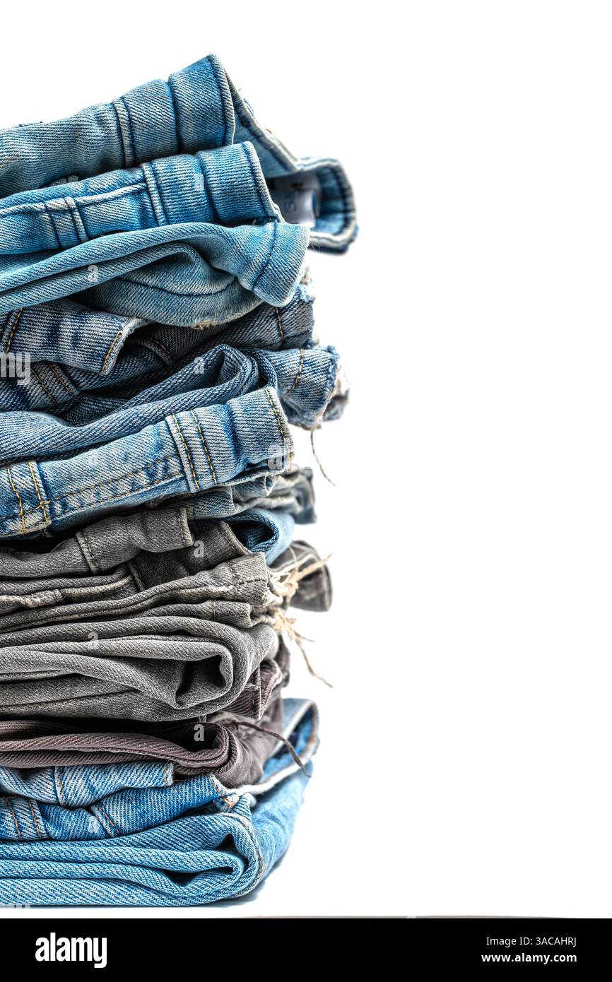 Stack of jeans isolated on white background Stock Photo