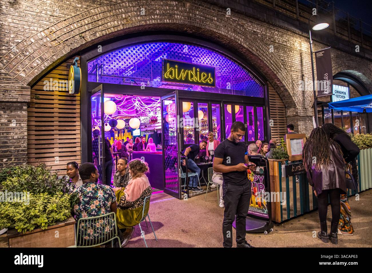 London, UK - September 14, 2023: Birdies Battersea Miniature golf course entrance at night. Stock Photo