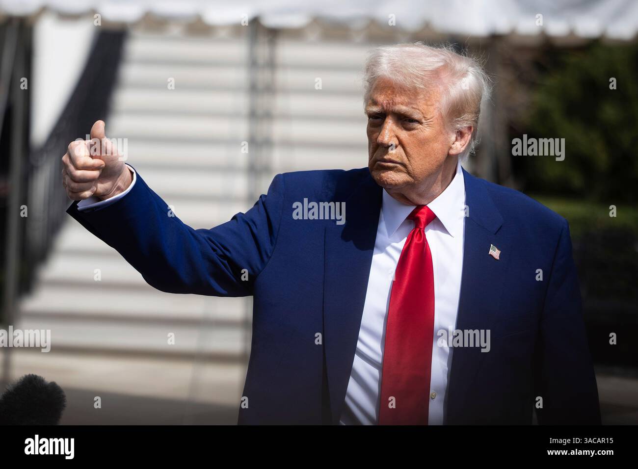 President Donald Trump gestures as he departs the White House April 3 ...