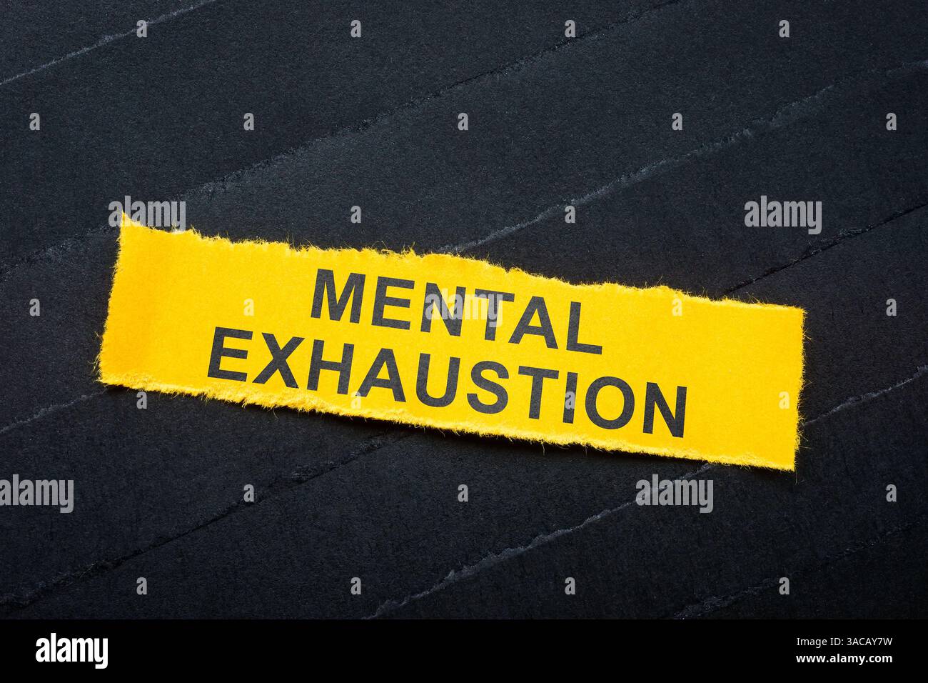 Dark strips with paper and one labeled mental exhaustion. Psychological stress. Stock Photo