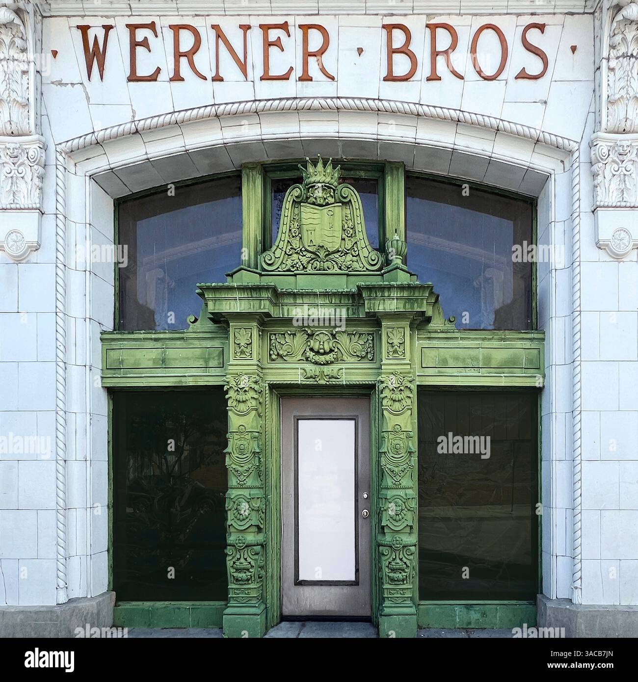 Elaborate green terra cotta facade of the historic Werner Bros Storage - Smartphone Captured Stock Image