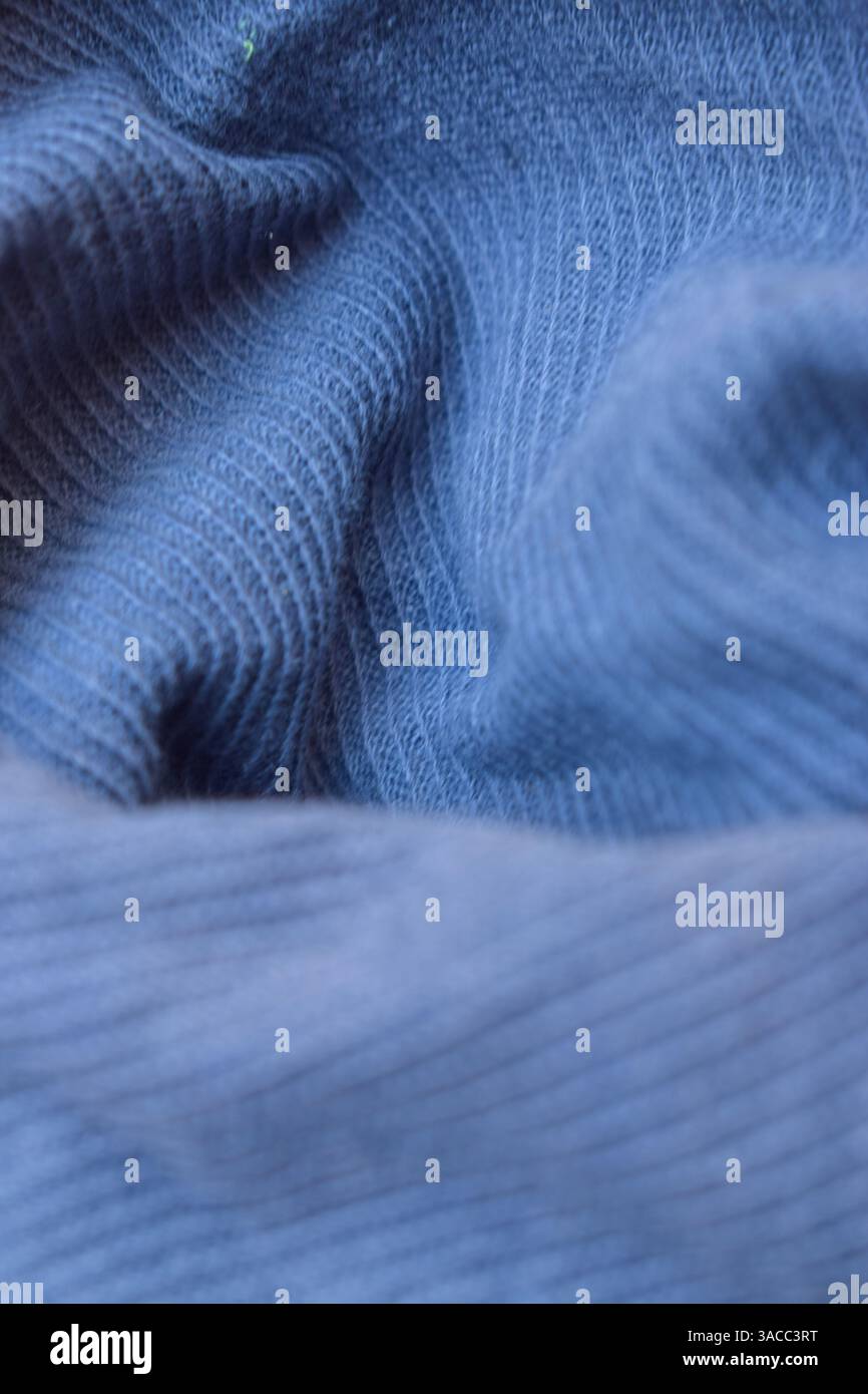 Folded Blue Denim Shirt Fabric Texture Close Up Background Stock Photo