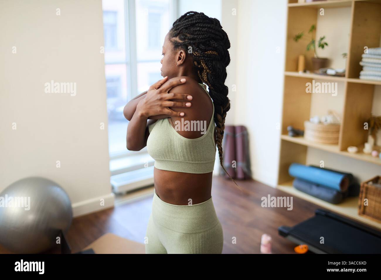 Woman stretching in cozy wooden hi-res stock photography and images - Alamy