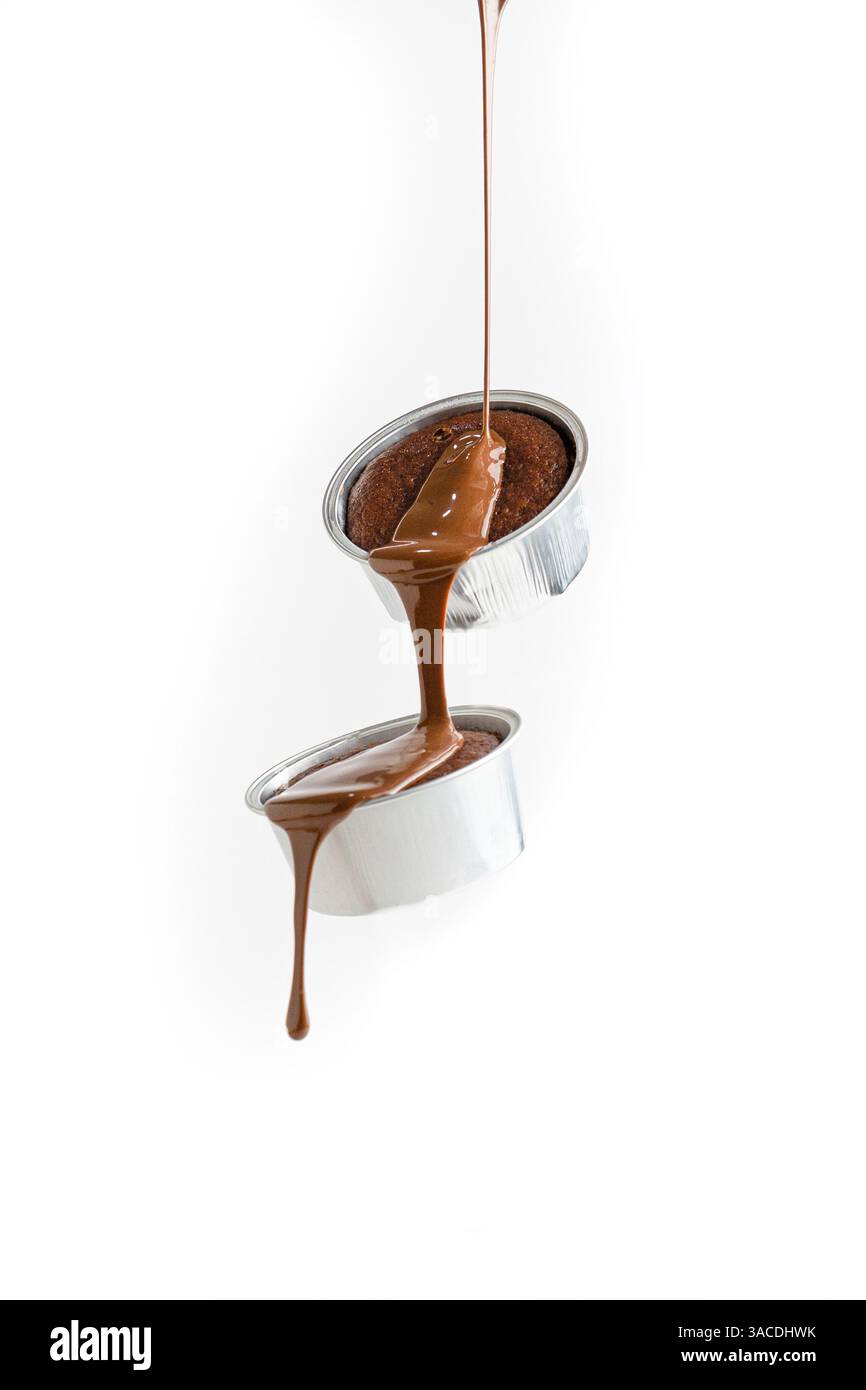 Flying Molten Chocolate Cakes with Dripping chocolate – Waterfall Dessert Scene on White Background Stock Photo