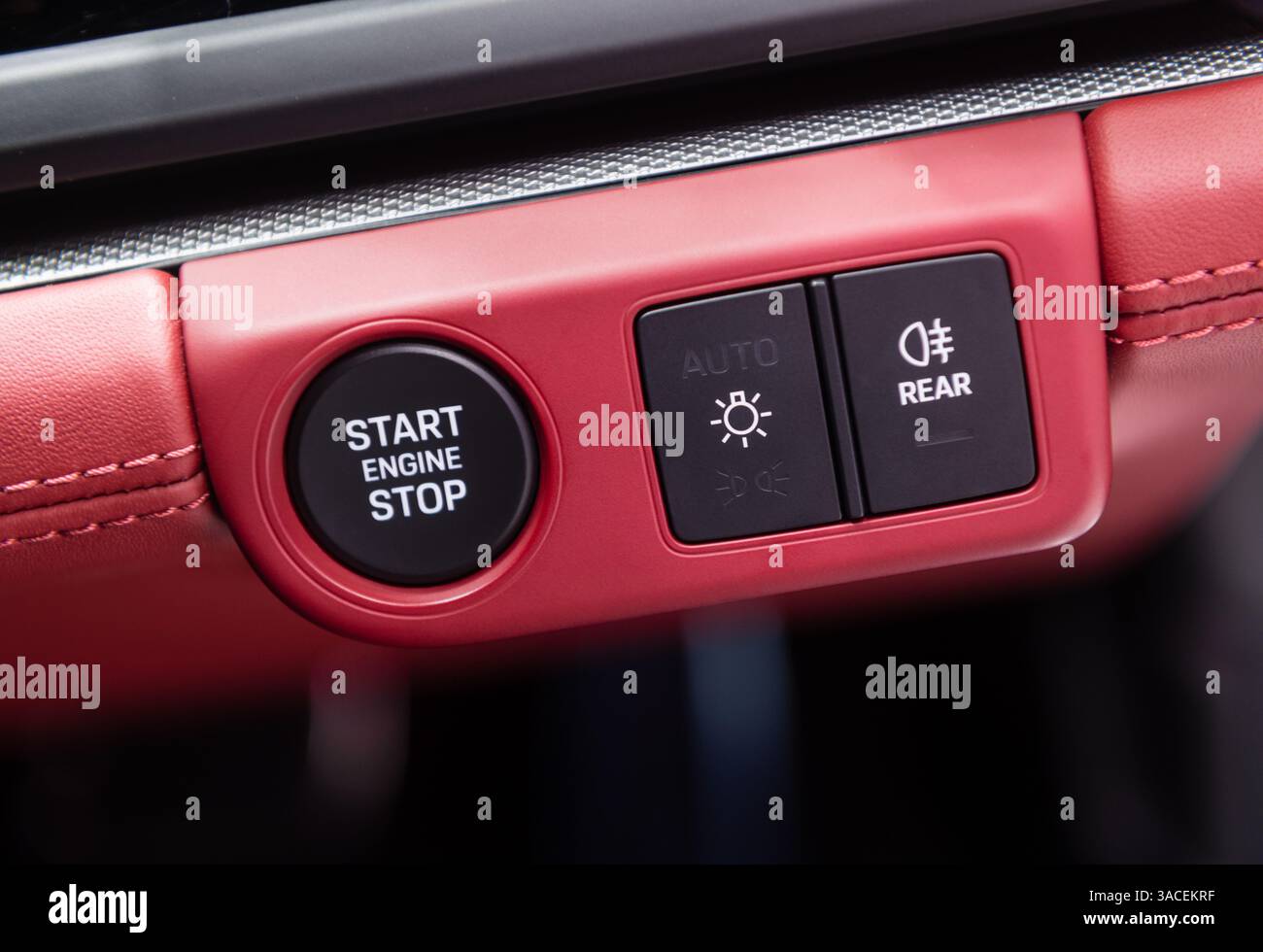 Car dashboard with focus on engine start stop button Stock Photo