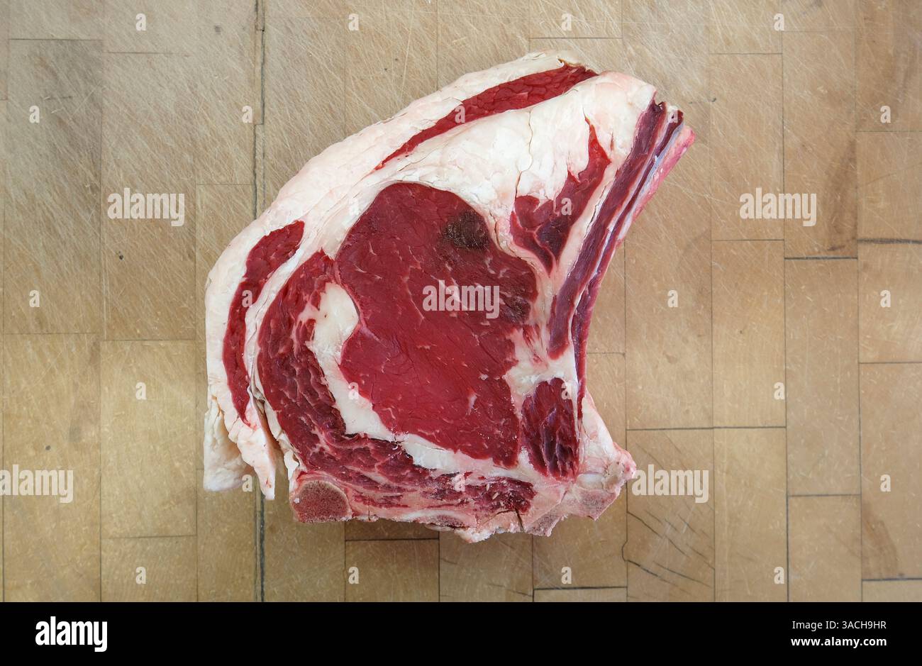 red meat beef steak on wooden butcher's block Stock Photo