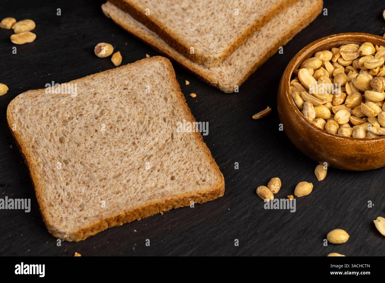thin wheat bread with bran and soft peanut butter, peanut butter on a ...
