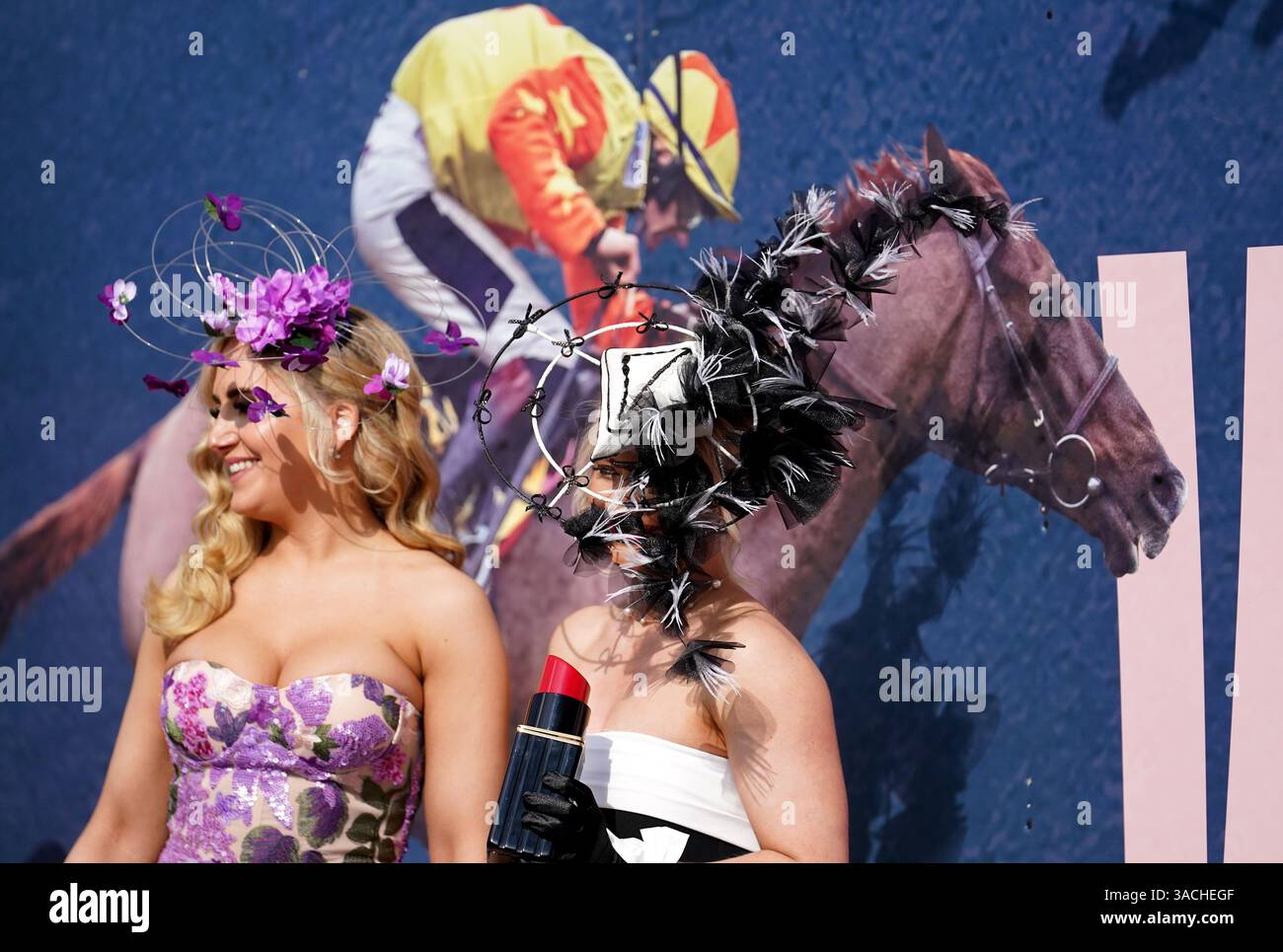 Randox Races Racegoers pose for photographs on day two of the Randox Grand National ...