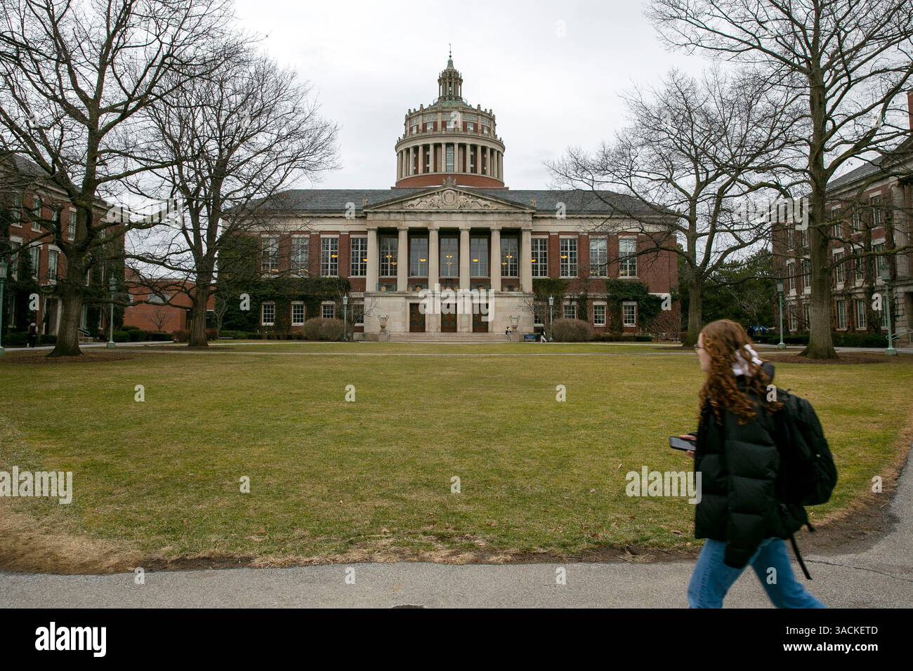 Rush Rhees Library Rochester FILE - A student walks by the Rush Rhees Library at the University of ...