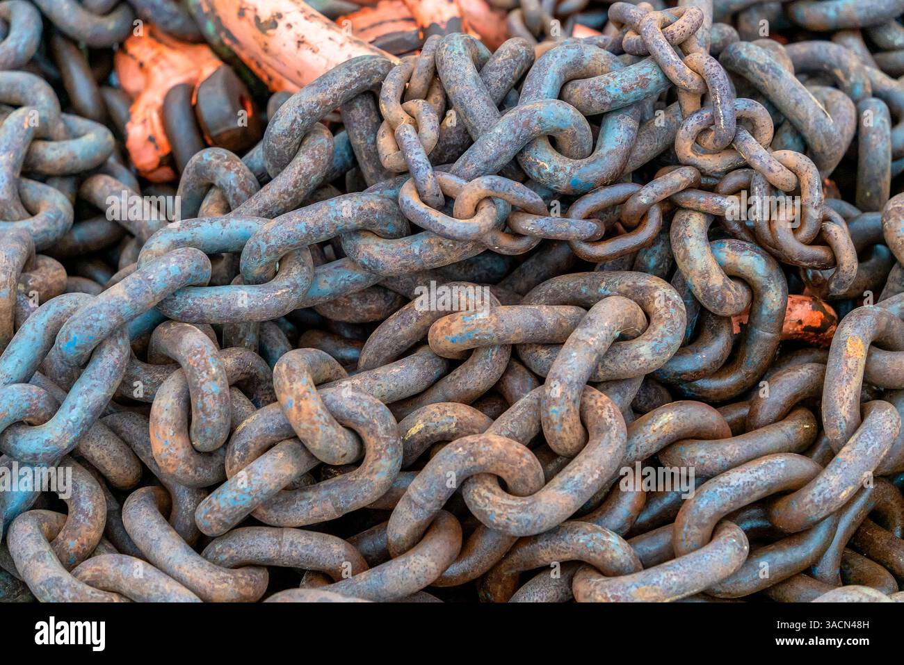 Detail shot of tangled rusty chains Stock Photo