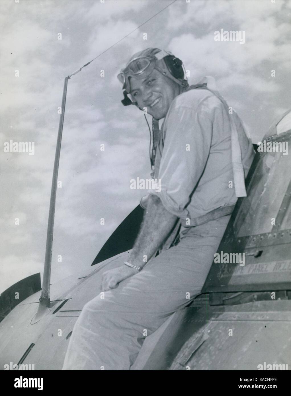 Marine Corps Major Robert F. Halladay, shown climbing out of his scout bomber, was awarded a gold star for leading five air strikes under anti-aircraft fire, recognizing his meritorious achievement. Stock Photo