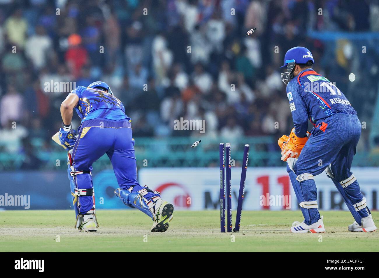 Mumbai Indians' Naman Dhir is bold out by Lucknow Super Giants' Digvesh ...