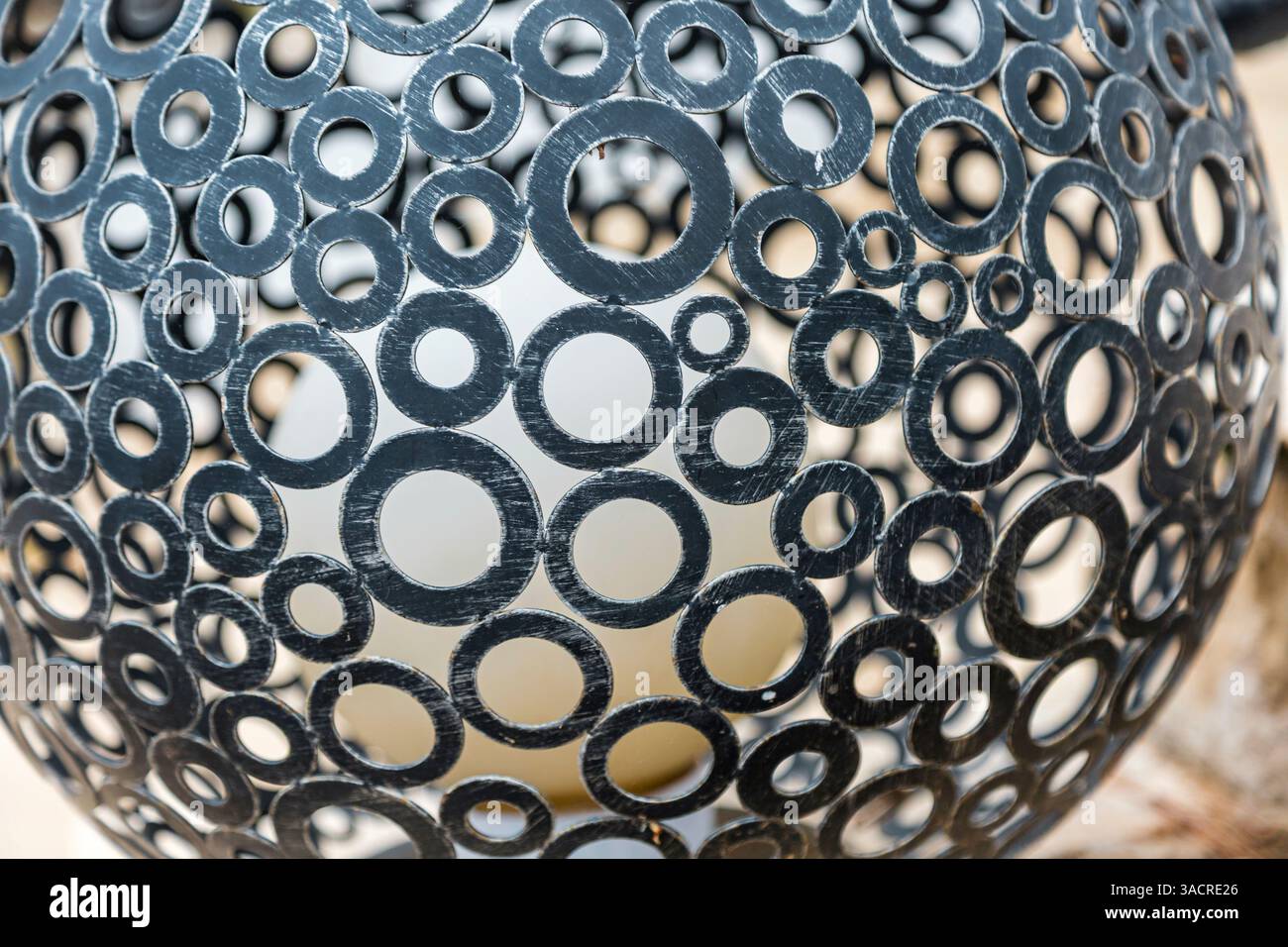 Metal ornament forged from many different sized iron rings Stock Photo