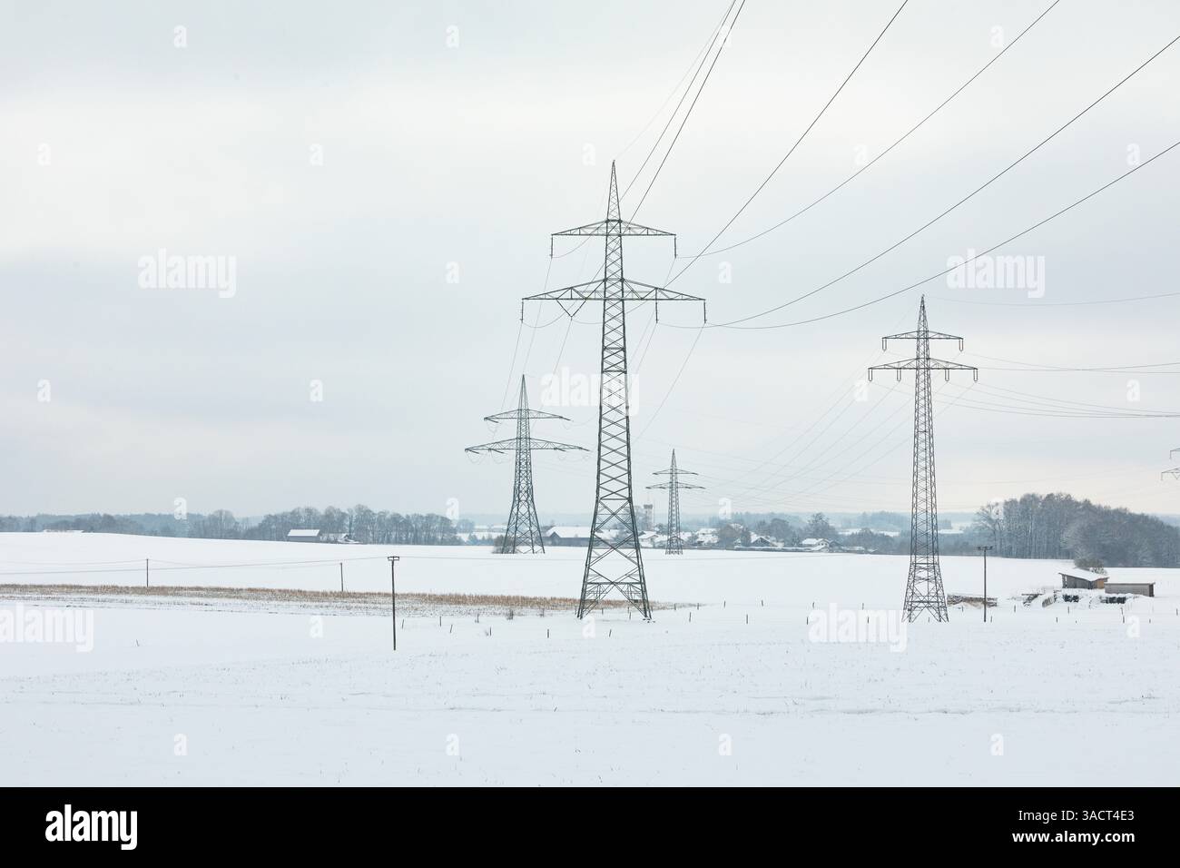 High-voltage pylons in winter Stock Photo - Alamy