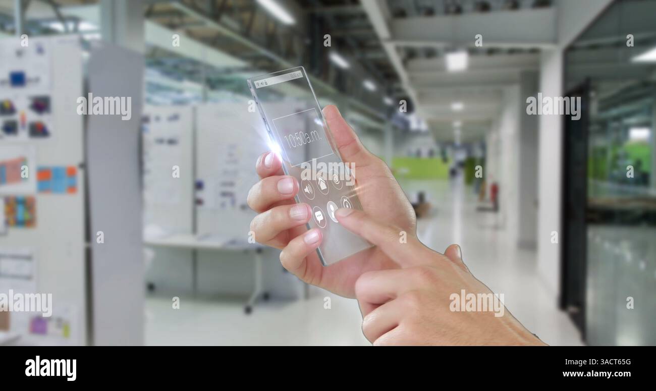 In office hallway, person interacting with futuristic transparent smartphone screen Stock Photo