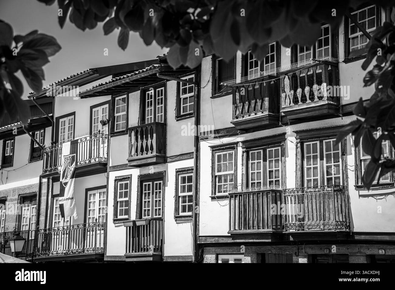 Traditional wooden Portuguese house facade at Sao Tiago square in the city center of Guimaraes, Portugal Stock Photo