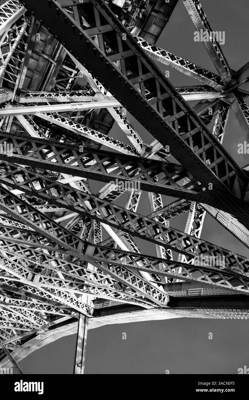 Architectural detail of iconic arched iron bridge Ponte Luis I in the Porto city center at night, Portugal Stock Photo