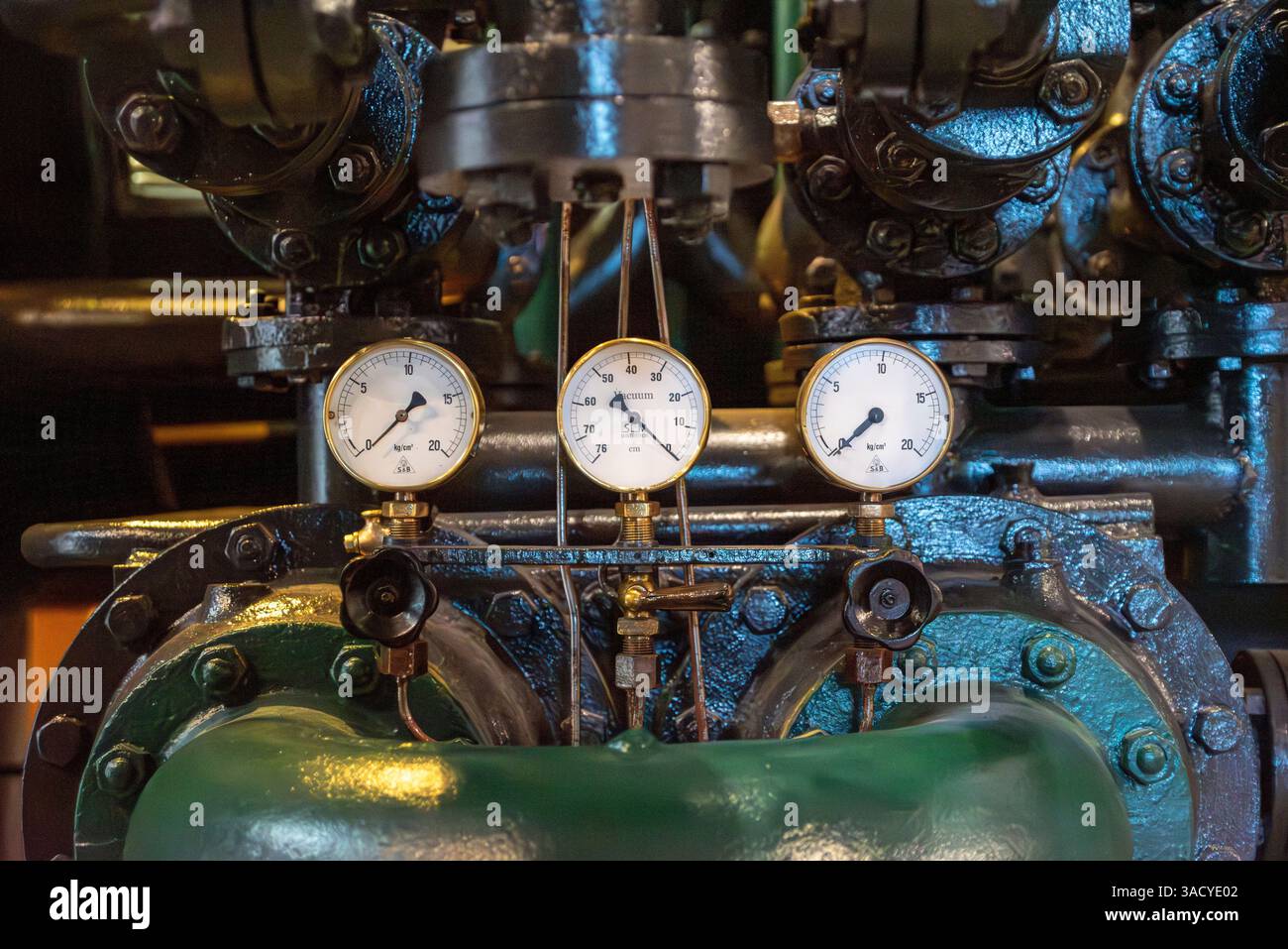 Detailed view of three pressure gauges on an industrial machinery in a ...