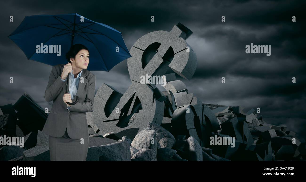 Holding blue umbrella, businesswoman stands among giant dollar signs under stormy sky Stock Photo