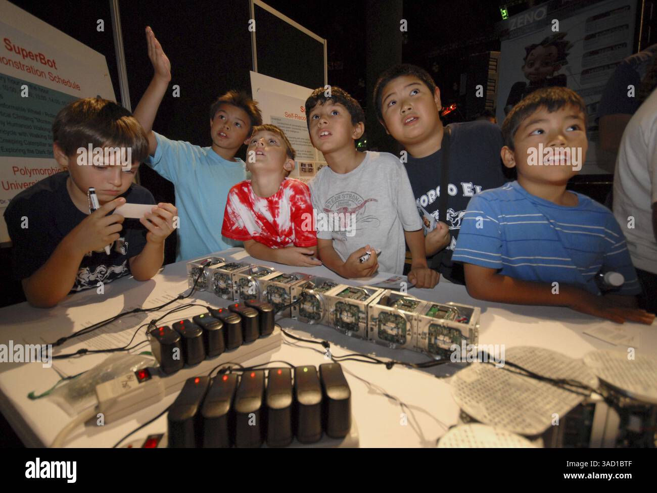 Sep. 13, 2007 - Los Angeles, California, USA - School children check out the latest inventions from USC's Polymorphic Robotics Lab at WIRED Magazine's NextFest 2007, a four-day festival of innovations from inventors and research and development labs from around the world at the Convention Center in Los Angeles, California on Thursday, September 13, 2007. Staged in thematic pavillions covering more than 150,000 square feet, the exhibition features advances in communication, design, entertainment, energy, the environment, exploration, medicine, health, robotics, security and transportation. (Cre Stock Photo