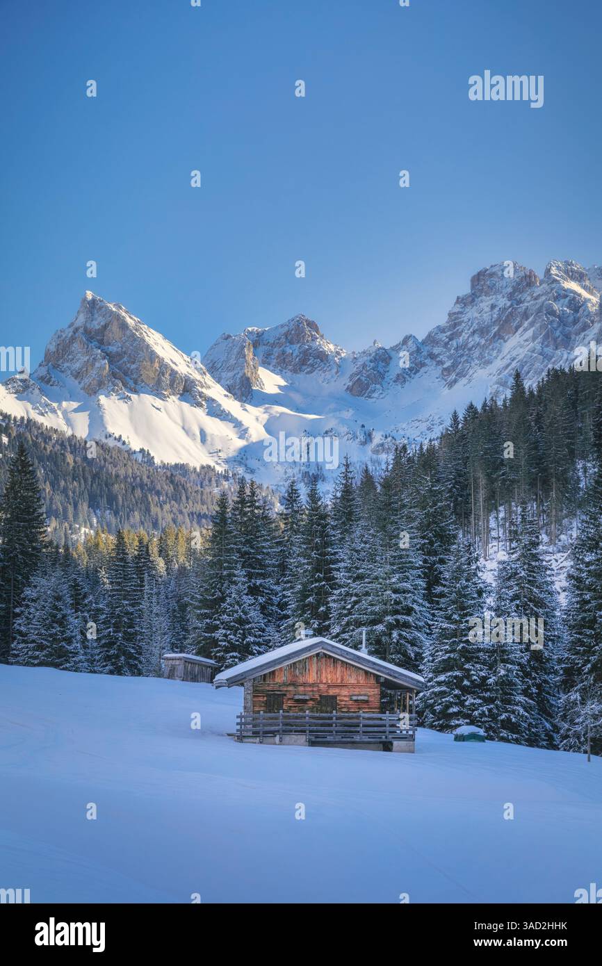 Solitary wooden hut in San Nicolo Valley on a cold winter morning, Pozza di Fassa, province of Trento, Trentino Alto Adige, Dolomites, Italy Stock Photo
