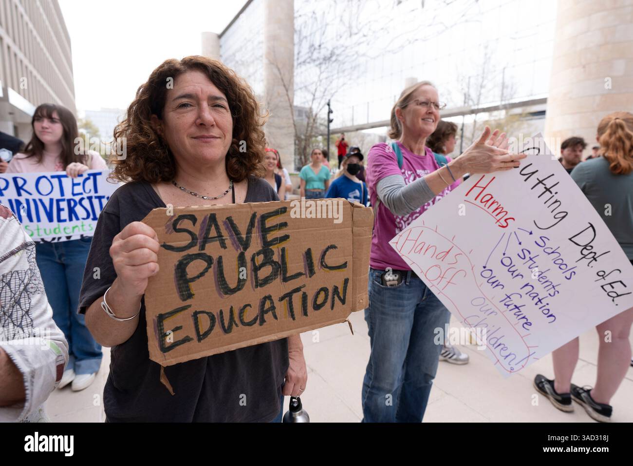 Amy Zeno, left, joins the Hands Off Our Schools rally outside the ...