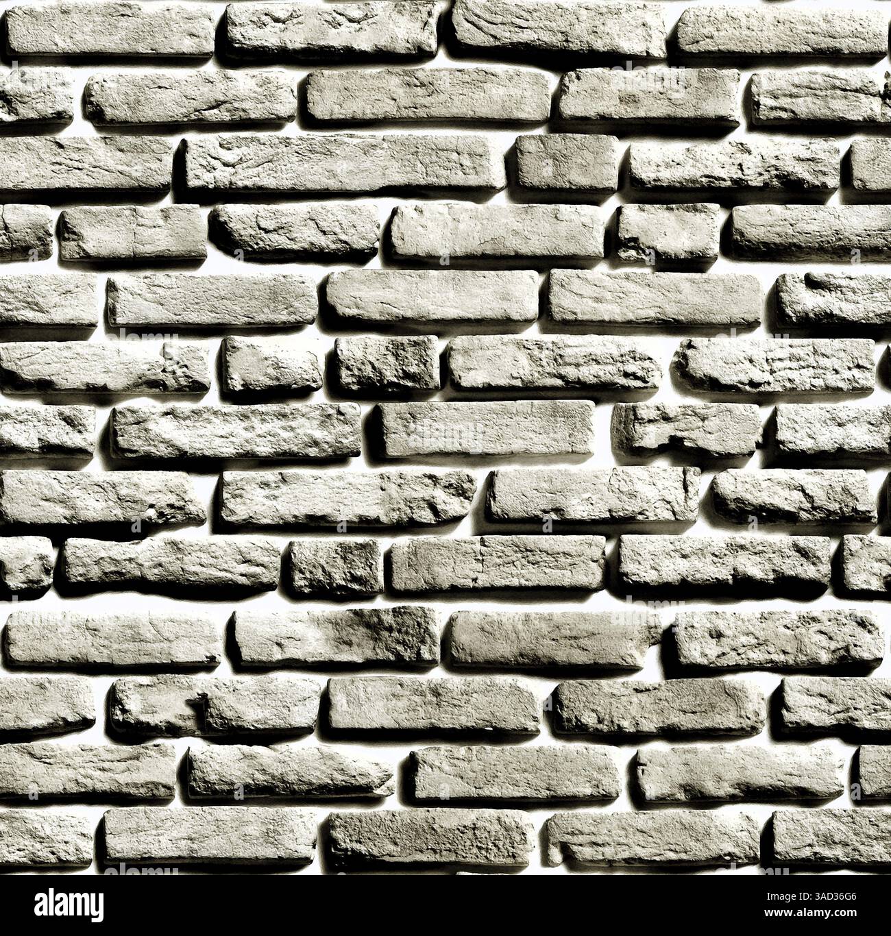 Gray brick wall creating a textured background with visible light and shadow effects.Belarus Stock Photo