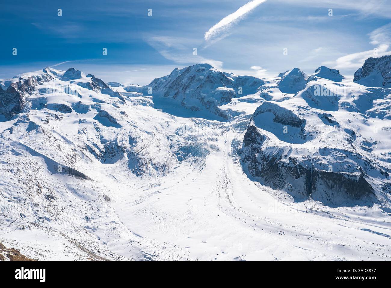 Snow Covered Alps with Glaciers and Clear Blue Sky in Zermatt Stock ...
