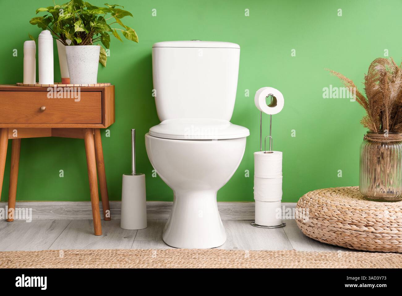 Interior of restroom with toilet bowl and table Stock Photo - Alamy