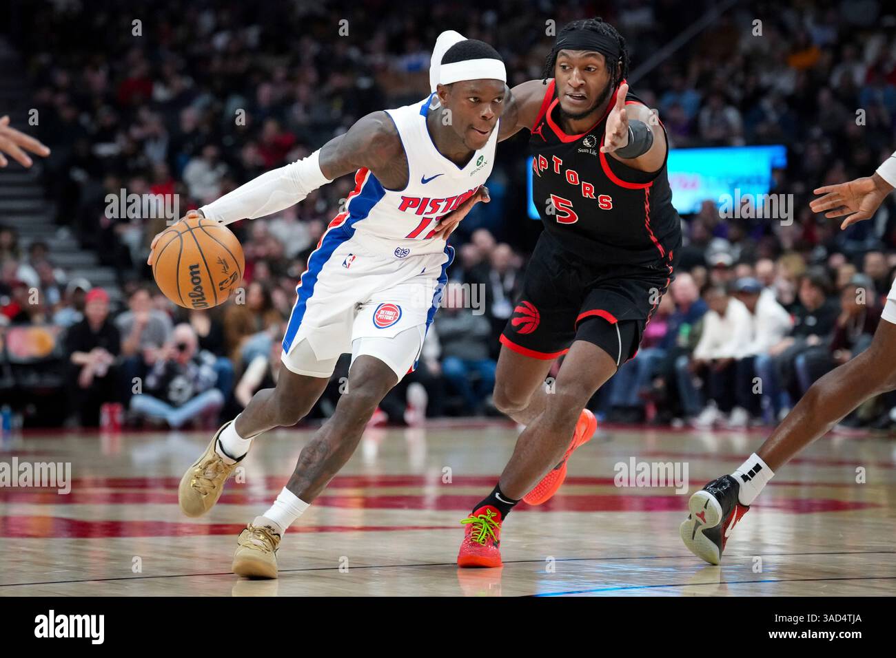 Detroit Pistons guard Dennis Schroder (17) drives past Toronto Raptors
