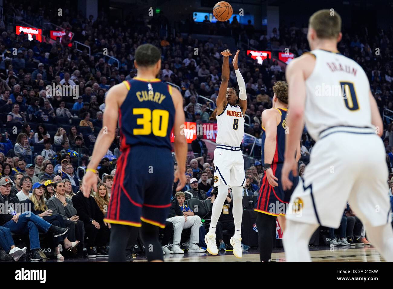 Denver Nuggets forward Peyton Watson (8) shoots a 3point basket during