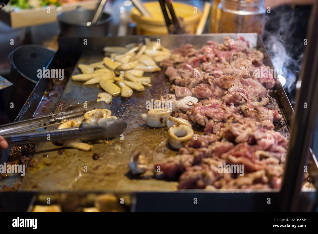 Grilled raw meat beef and pork (barbeque, bbq) a food cooking on wagyu ...