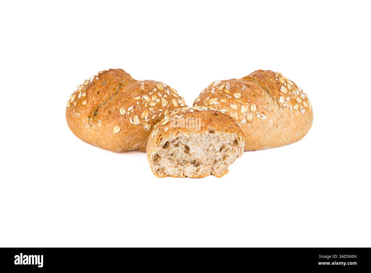 Crispy bread rolls with oat isolated on white background. Fresh crispy bread rolls. Three bread rolls on white. Stock Photo