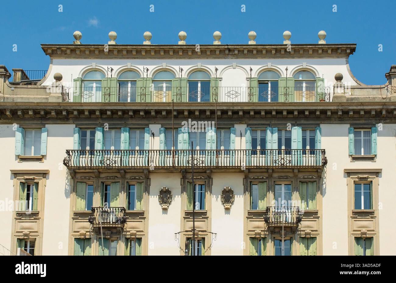 The historic Palazzo INA in the centre of Udine, Friuli, N.E. Italy. Built 1921-1924, its eclectic facade blends Neoclassical & Historicist elements Stock Photo