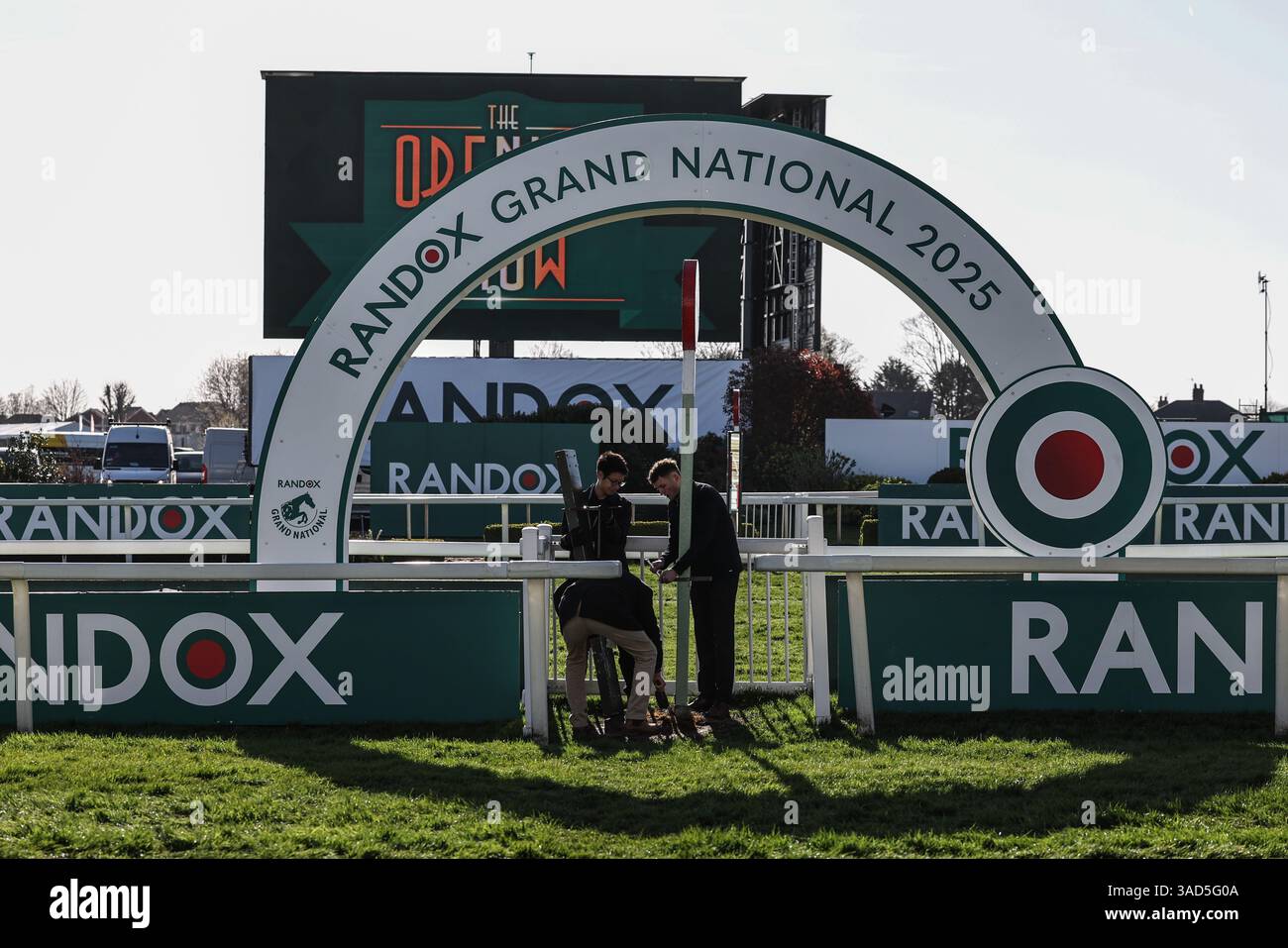 Randox Races Race course staff prepare the finish line for the grand national during ...