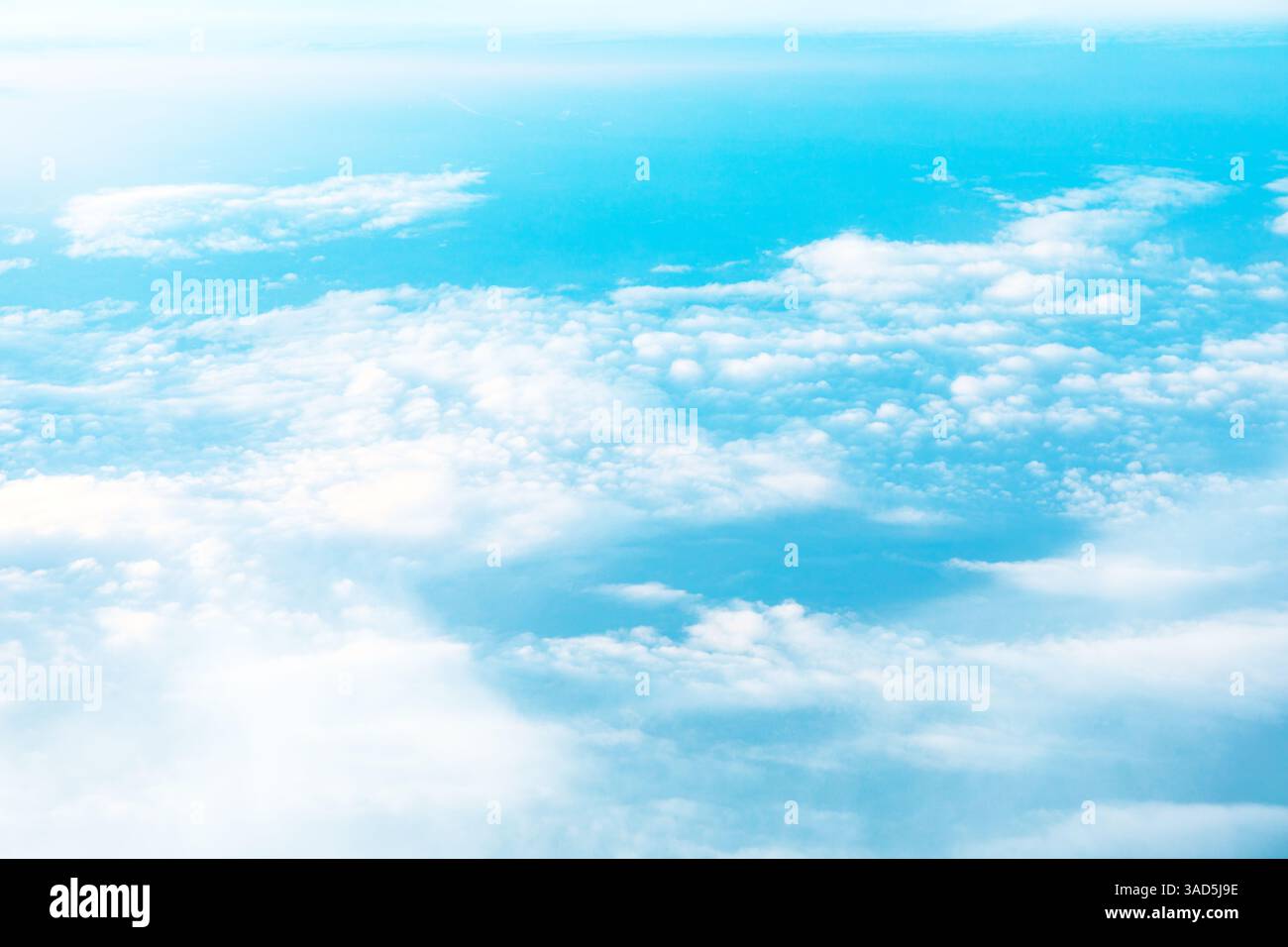 High altitude view of cumulus clouds against a vibrant azure backdrop ...