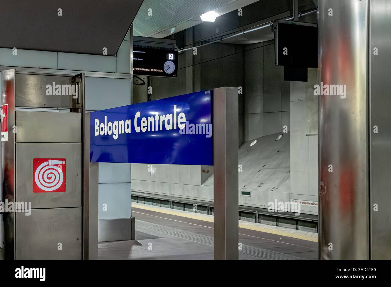 A blue Bologna Centrale station sign on the lower underground level of Bologna Centrale train station in Bologna ,Italy Stock Photo