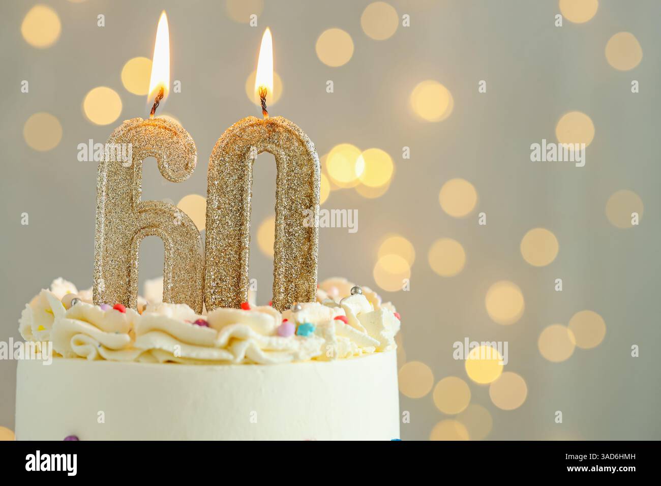 60th birthday. Tasty cake with burning number shaped candles and ...