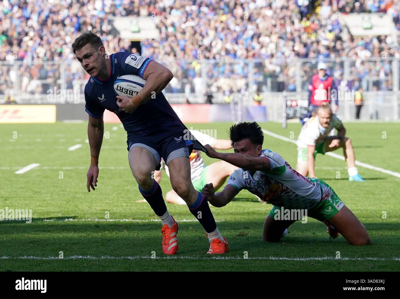 leinster-s-garry-ringrose-left-evades-a-tackle-from-harlequins