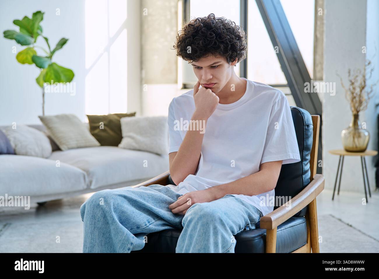 Frustrated man sitting on chair hi-res stock photography and images - Alamy
