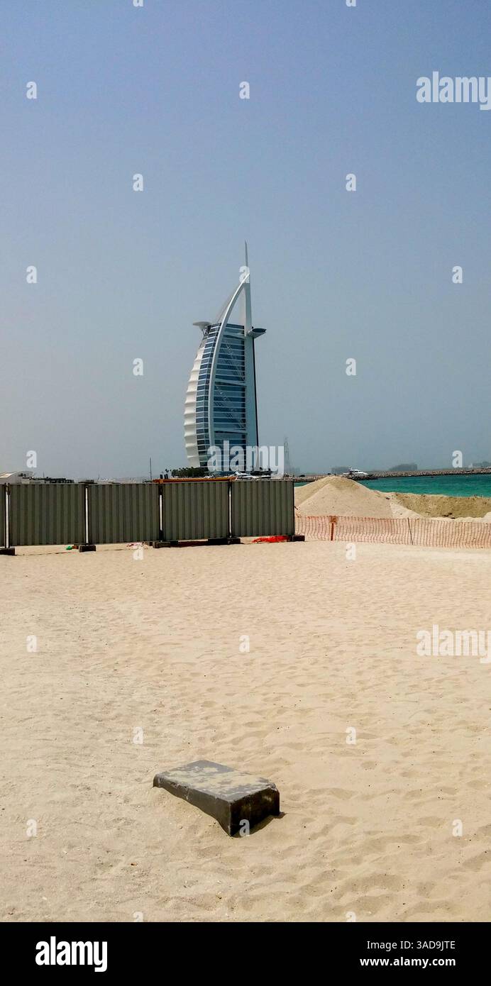 Gallery Detail: A Sandy Beach With Construction Barriers In The Foreground And