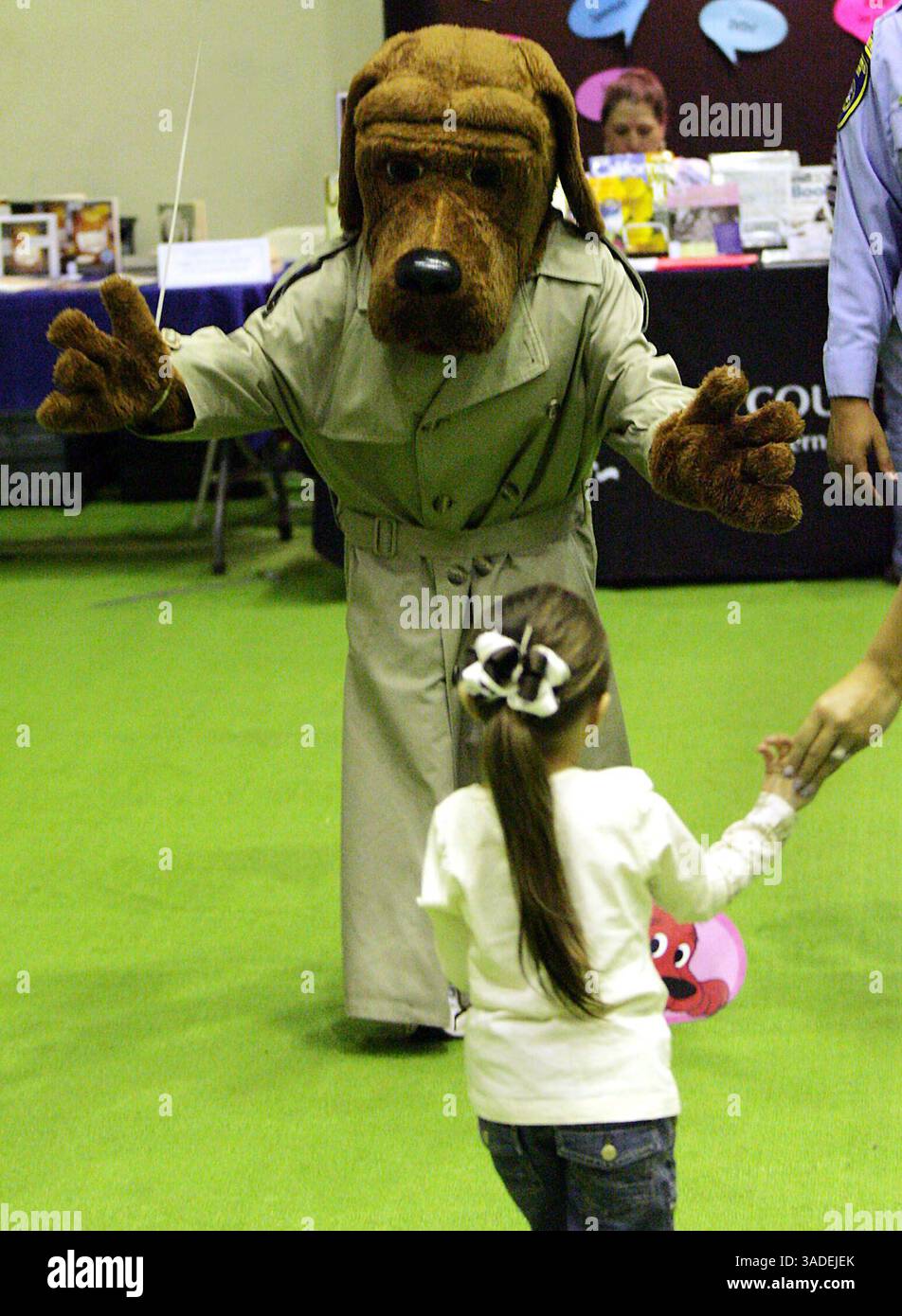 Giselle Ibarra, gets a hug from McGruff the Crime Dog, Saturday, at ...