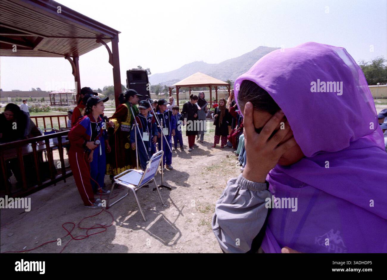 Aug 24, 2005; Kabul, AFGHANISTAN; A blind female athlete listens to songs played during game day at Bagh-e-Zanana. More than 300 athletes, including 80 female athletes, experienced a taste of happiness and achievement for the first time in their lives. They competed in athletics, bocce and football (soccer). Because of cultural restrictions, males and females competed at separate venues..  (Credit Image: Kash Gabriele Torsello/ZUMAPRESS.com) Stock Photo