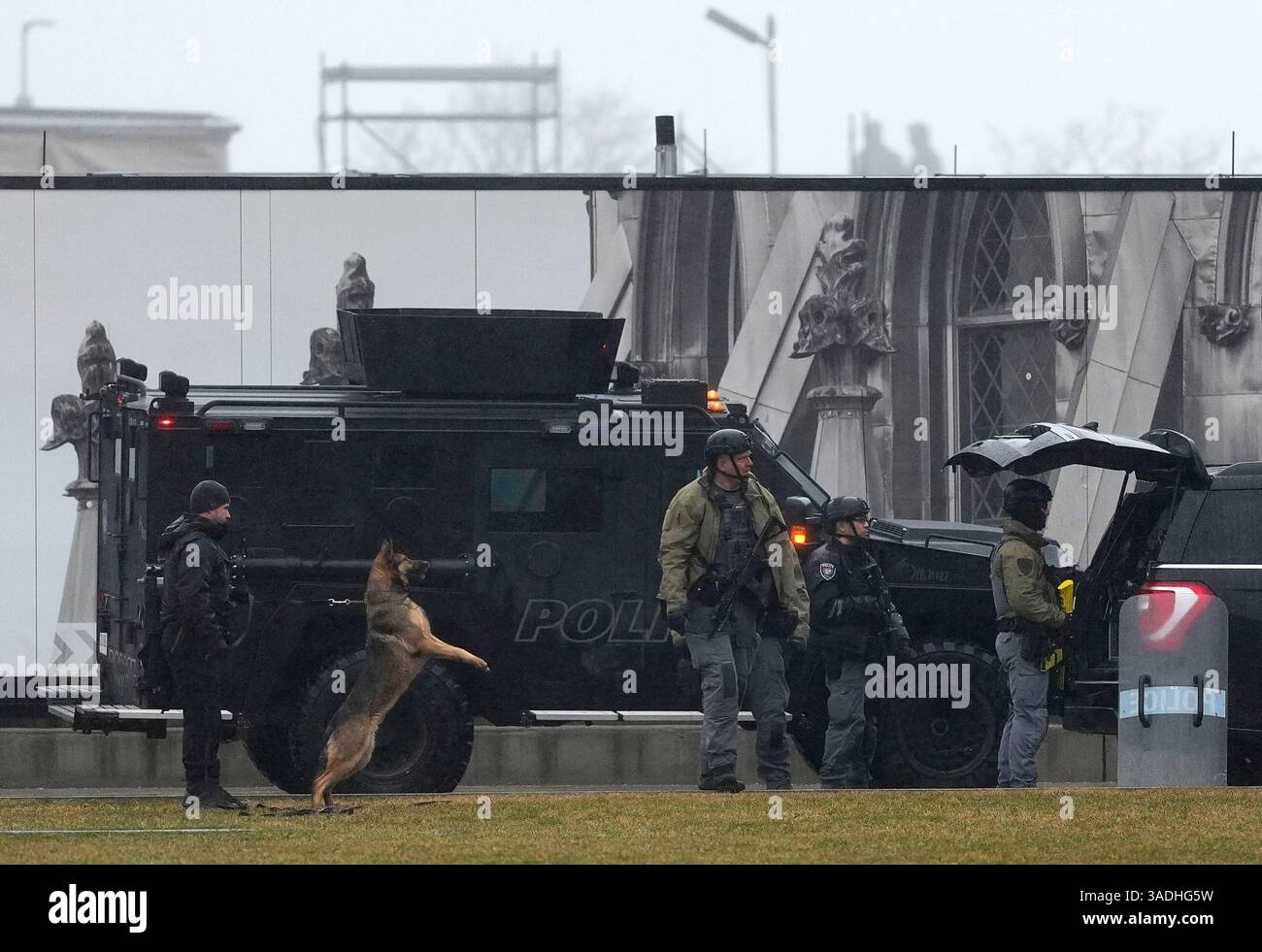 Law enforcement and a police dog respond to a man barricaded inside the ...