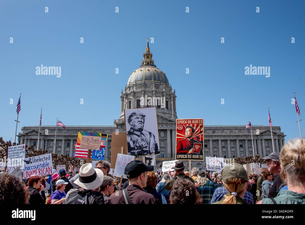 San Francisco, USA. 5th Apr 2025. Thousands gather at San Francisco Civic Center in one of many  'Hands Off!' protests against Donald Trump and Elon Musk. Signs shsow Trump and musk looing like communist or nazi rulers with City Hall in the background.  Credit: Shelly Rivoli/Alamy Live News - Stock Image