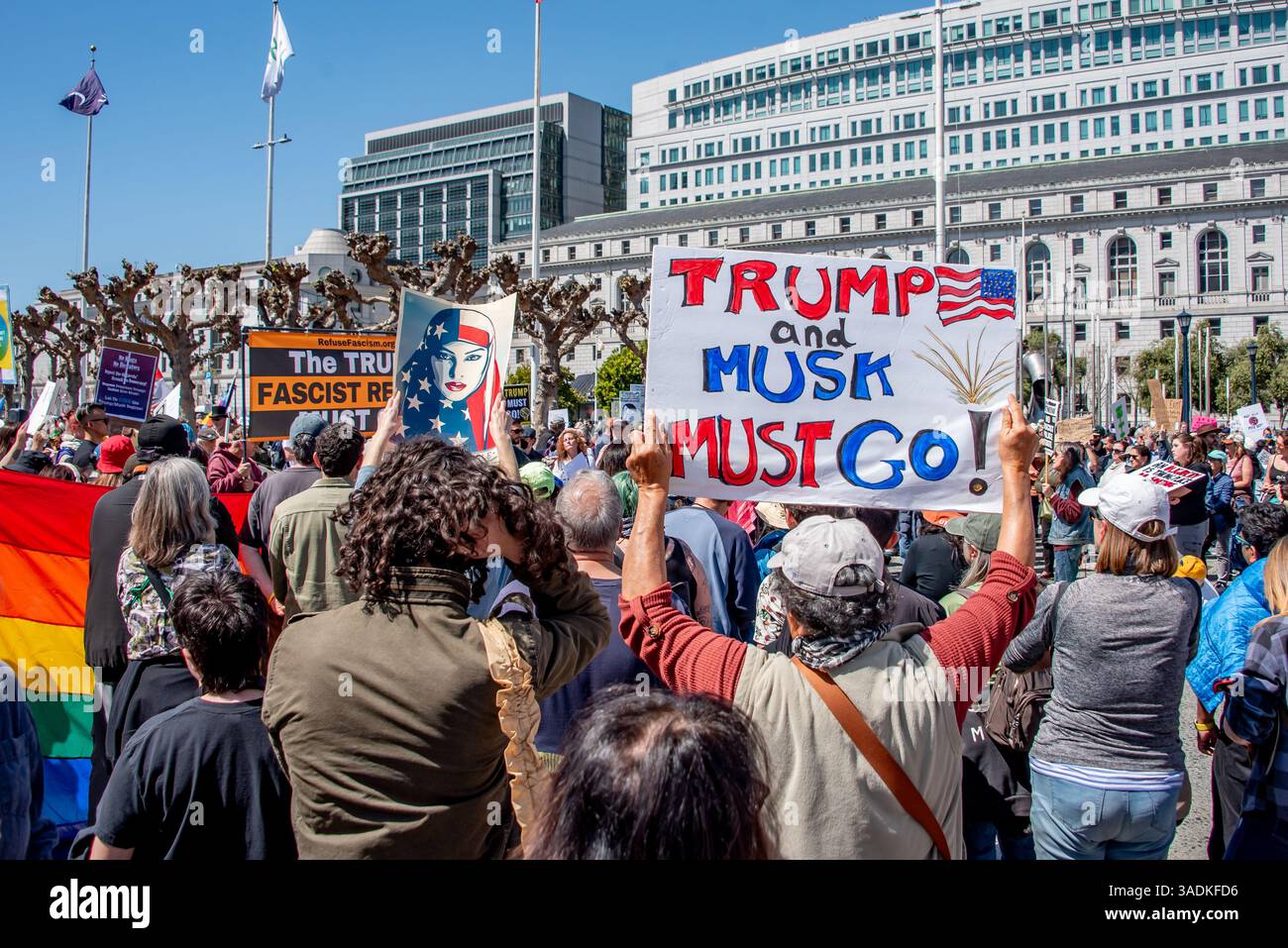 San Francisco, USA. 5th Apr 2025. Thousands gather in San Francisco at Civic Center Plaza in one of several 'Hands Off!' protests against Donald Trump and Elon Musk. Many signs are held above the thick crowd, including one reading, 'Trump and Musk Must Go!'  Credit: Shelly Rivoli/Alamy Live News - Stock Image