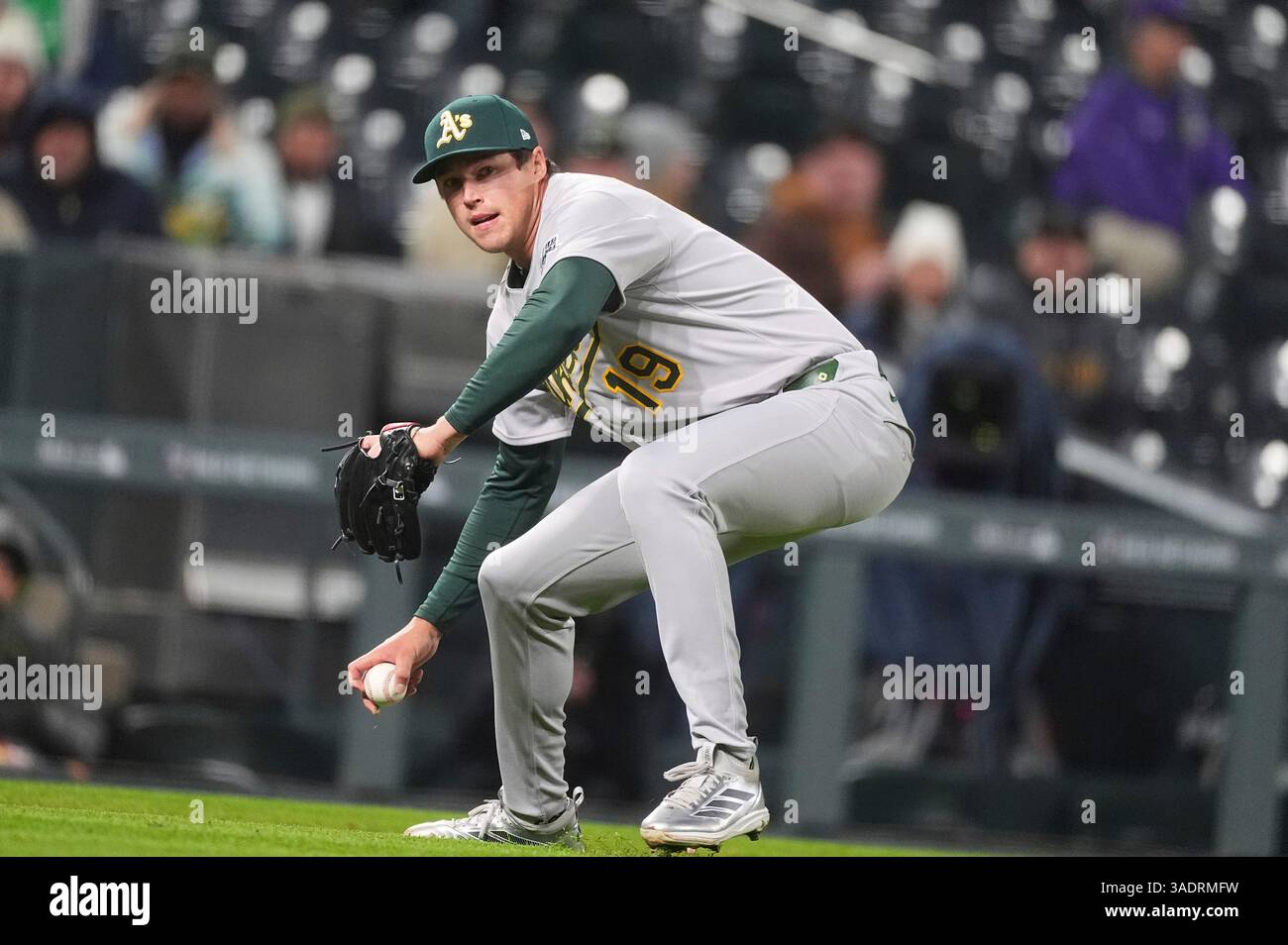 Pinch Bat Oakland Athletics relief pitcher Mason Miller fields an infield single ...